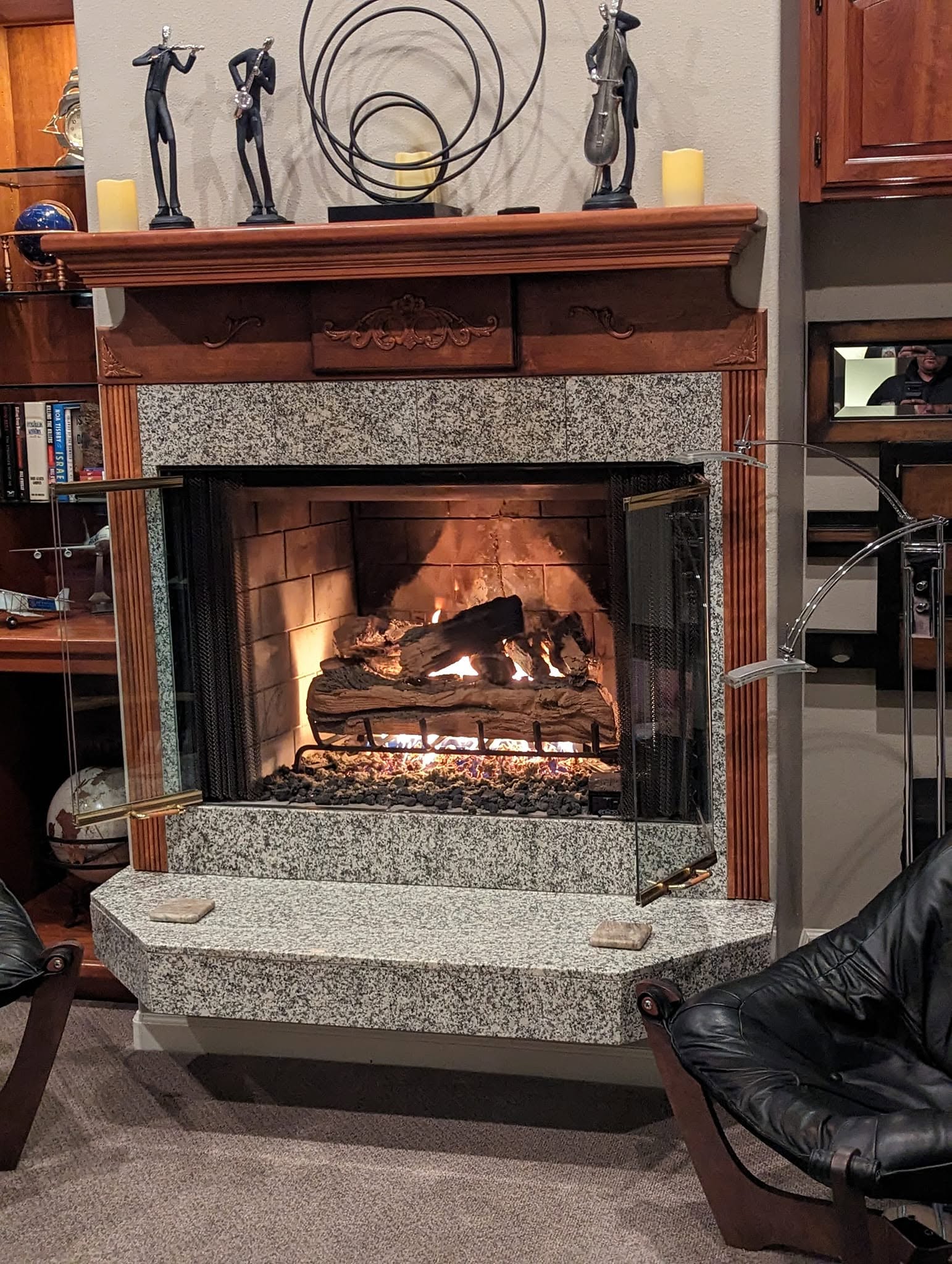 Granite-surround fireplace with an active fire